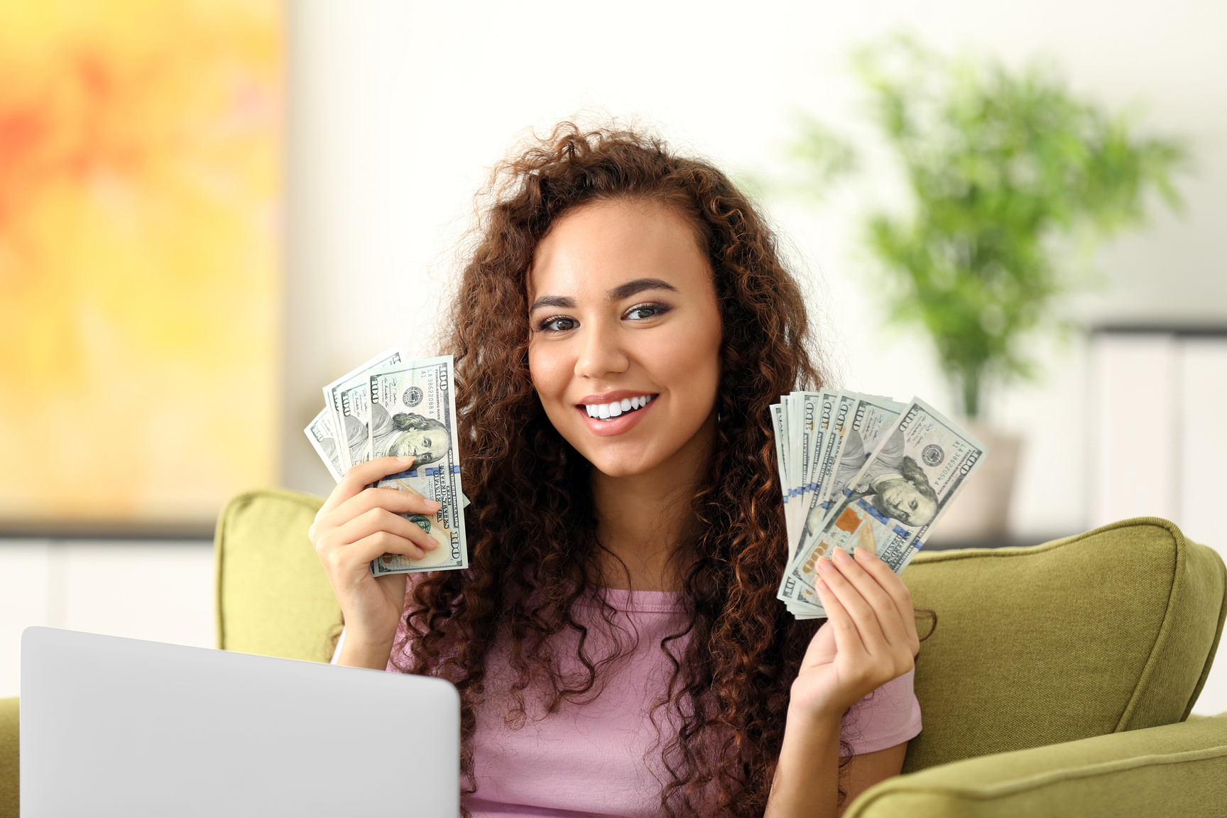Young Woman Earning Cash Online 