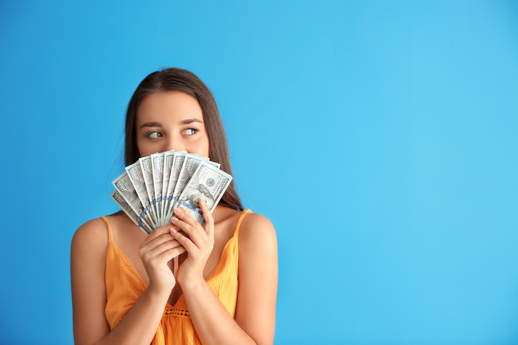 Happy Young Woman with Money on Color Background